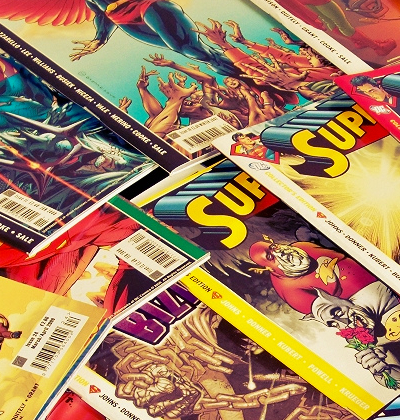 photo of a pile of various comic books