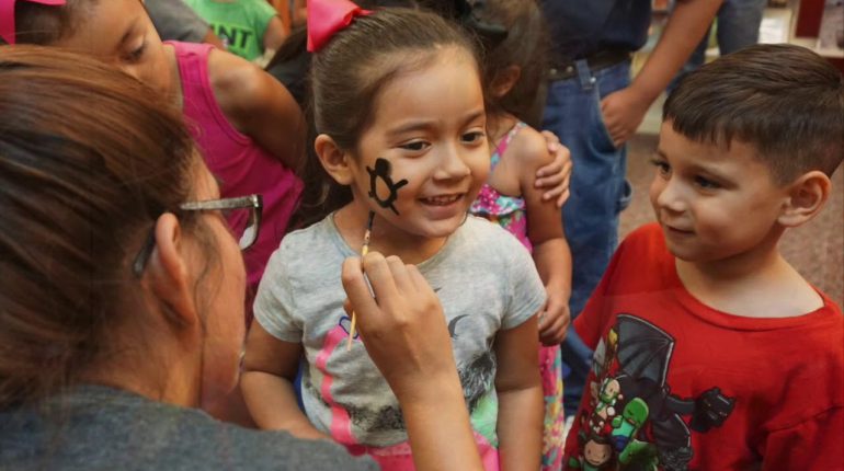 photo of children receiving face painting